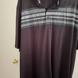 Black with shades of grey striping at the top Reebok golf shirt.